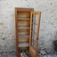 Showcase an old door, small bookshelf.