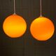 Pair of orange glass ball suspensions, 70s.