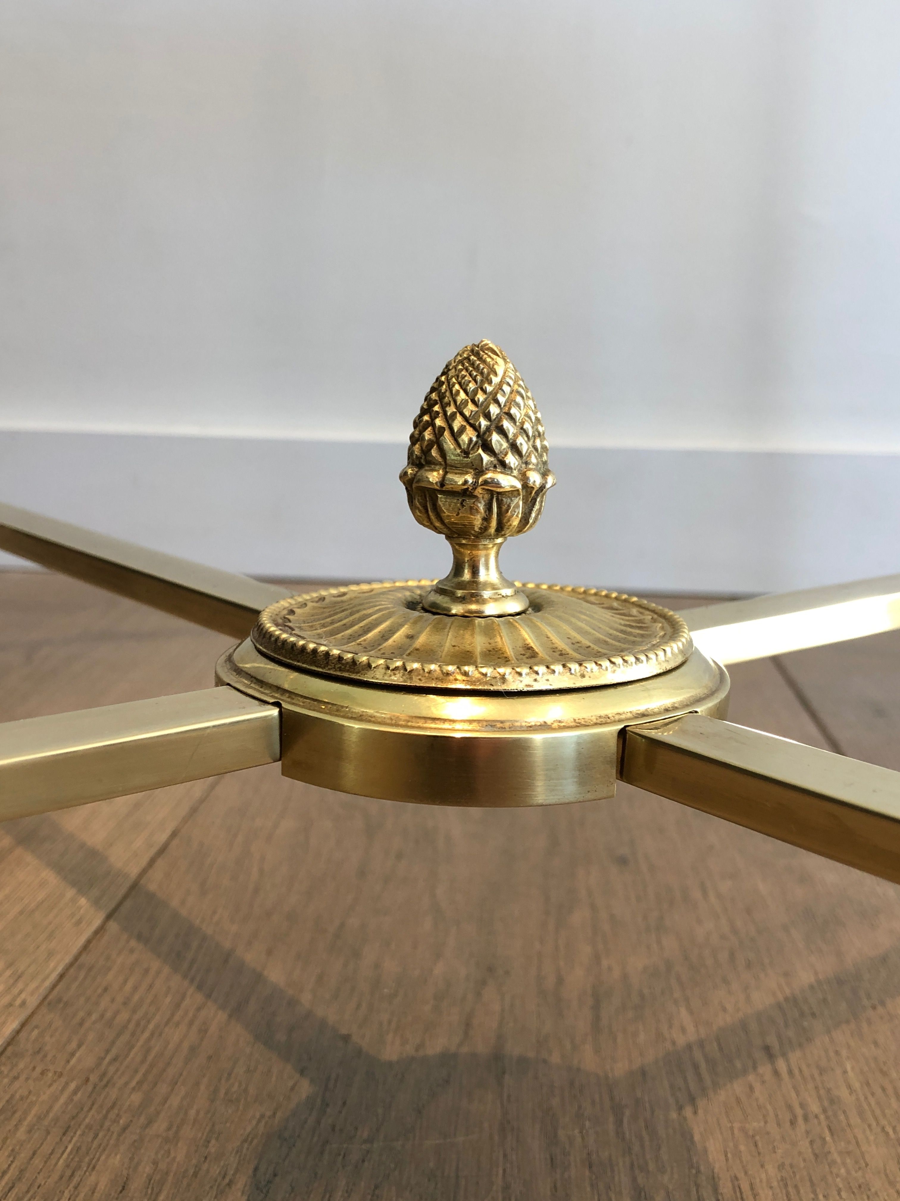 Round brass coffee table. Maison Baguès