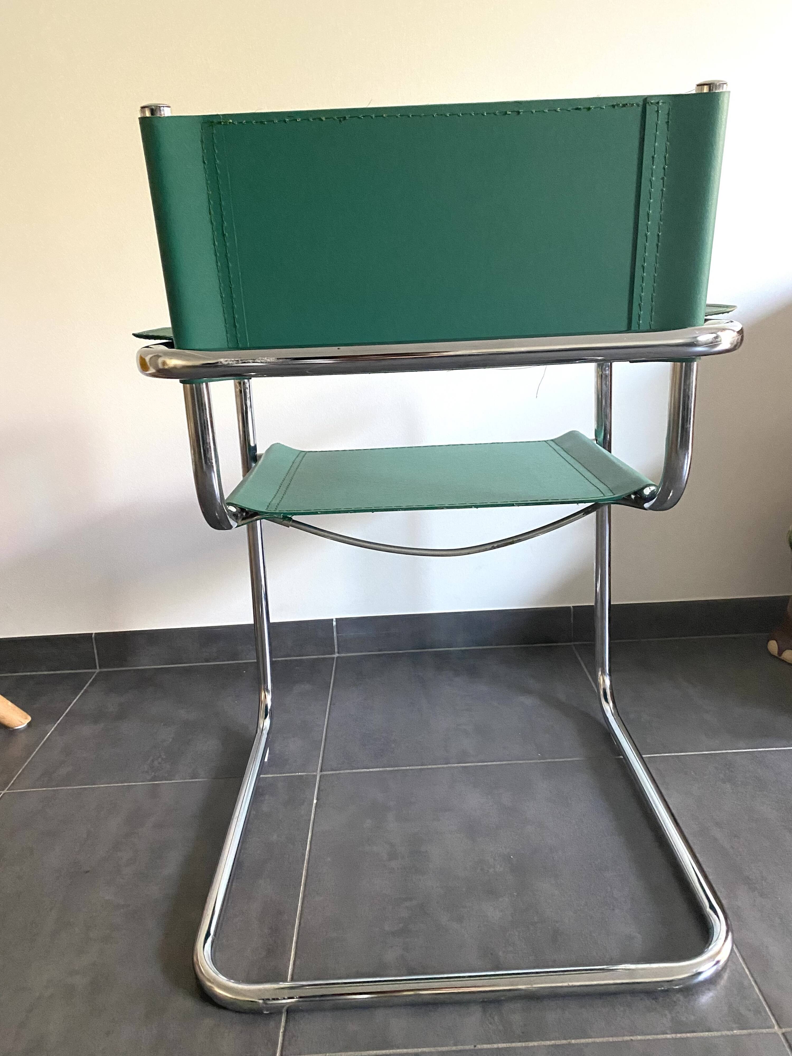 Pair of faux leather and chrome armchairs