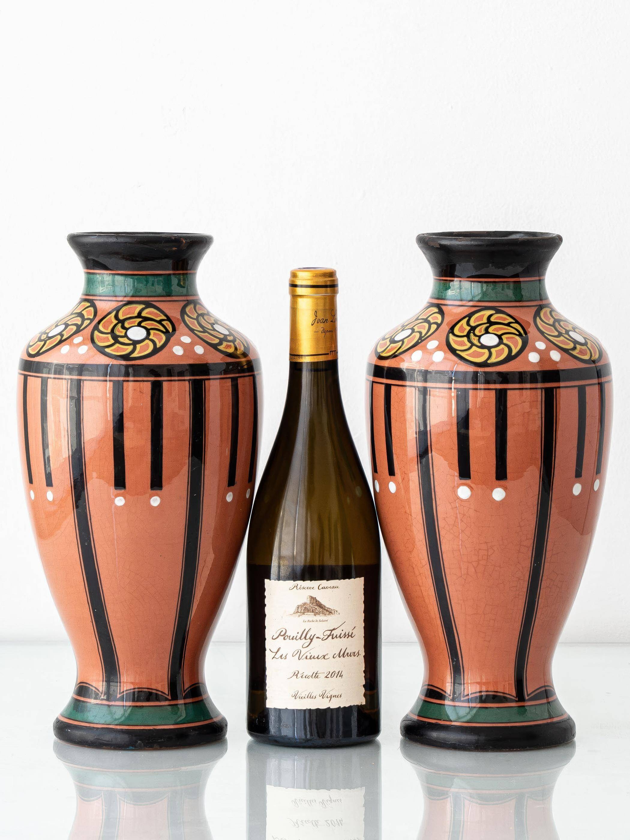 Pair of Dutch Art Deco vases, hand-painted Gouda-style ceramic with bold glazing.