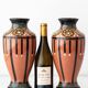 Pair of Dutch Art Deco vases, hand-painted Gouda-style ceramic with bold glazing.