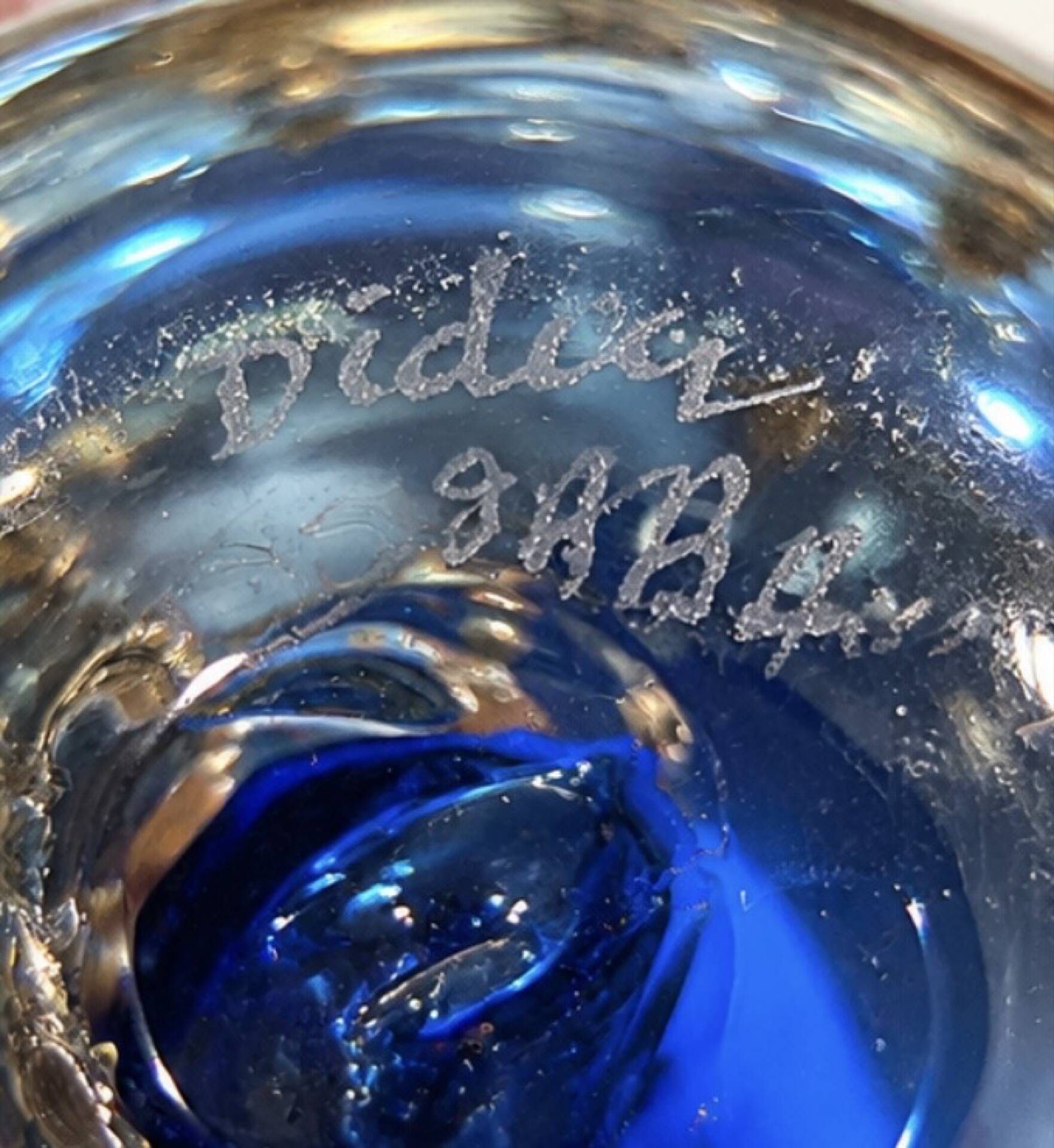 Art glass bottle signed Didier SABA, with cobalt blue decoration and inclusions.