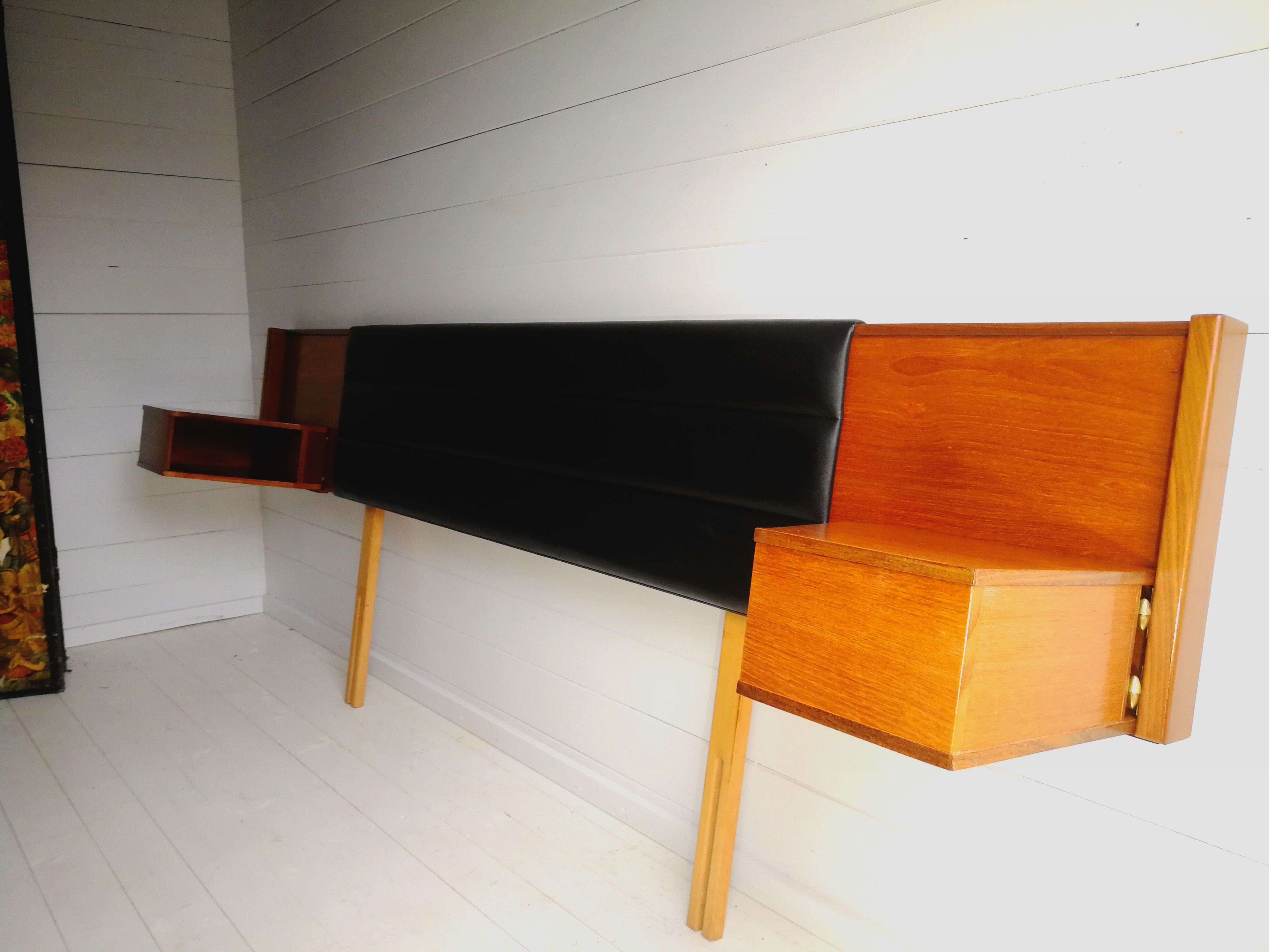 Mid century 1970s retro teak headboard with two hinged bedsides, upholstered in black by 'slumberlan