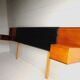 Mid century 1970s retro teak headboard with two hinged bedsides, upholstered in black by 'slumberlan