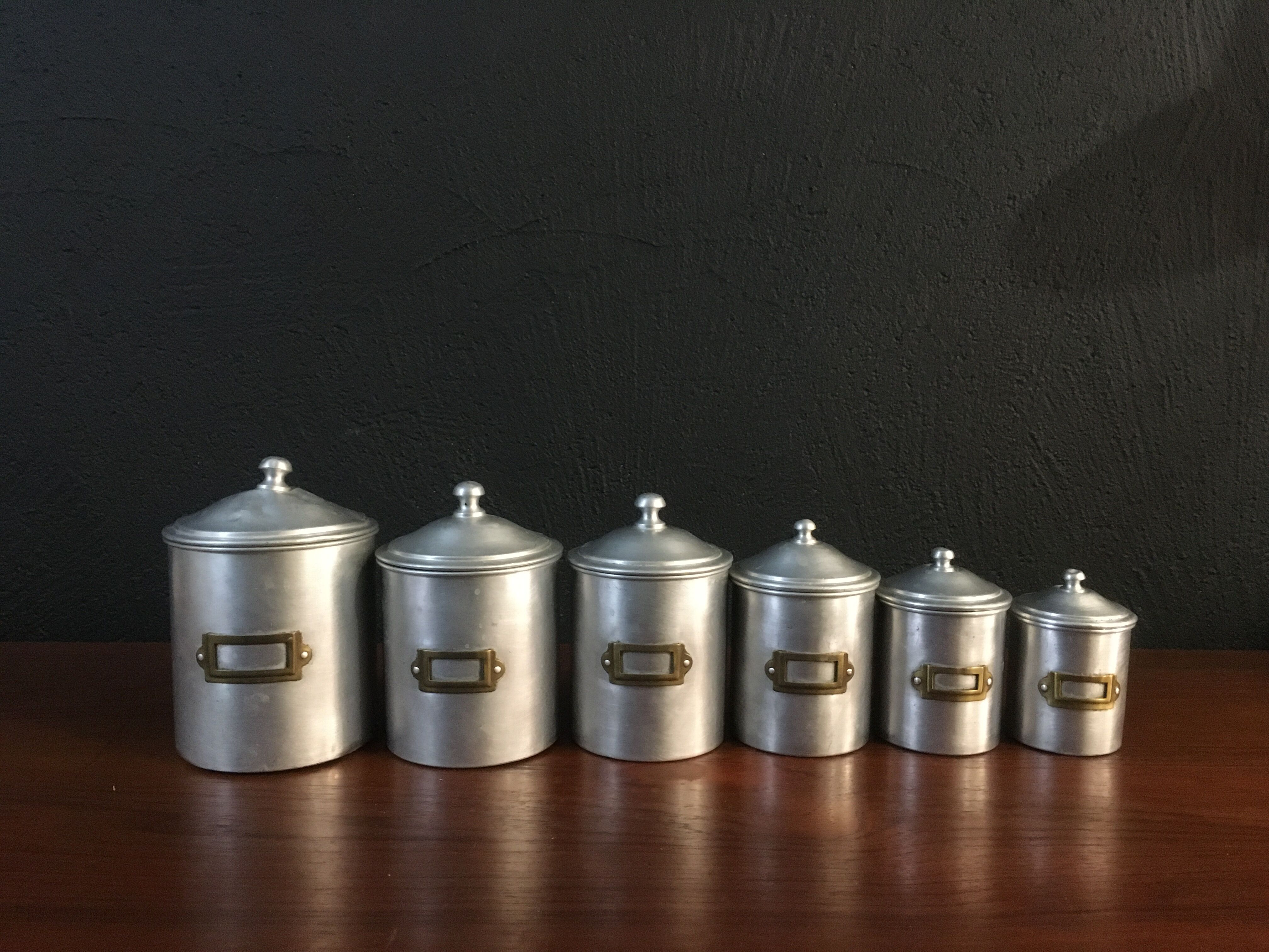 Six aluminum spice pots
