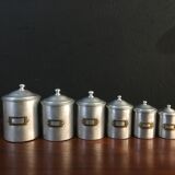 Six aluminum spice pots
