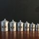 Six aluminum spice pots