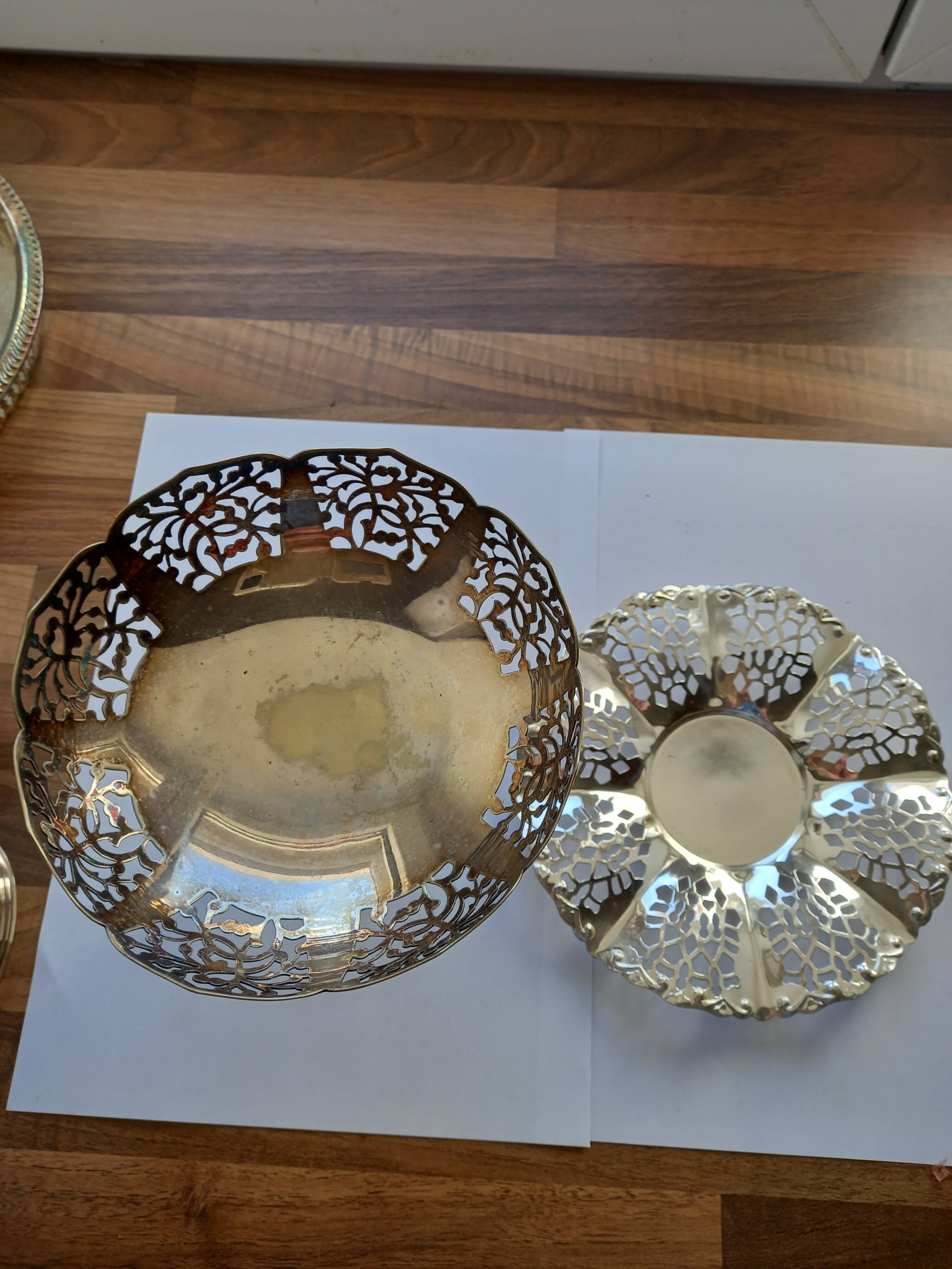 Two metal cups with an openwork design.