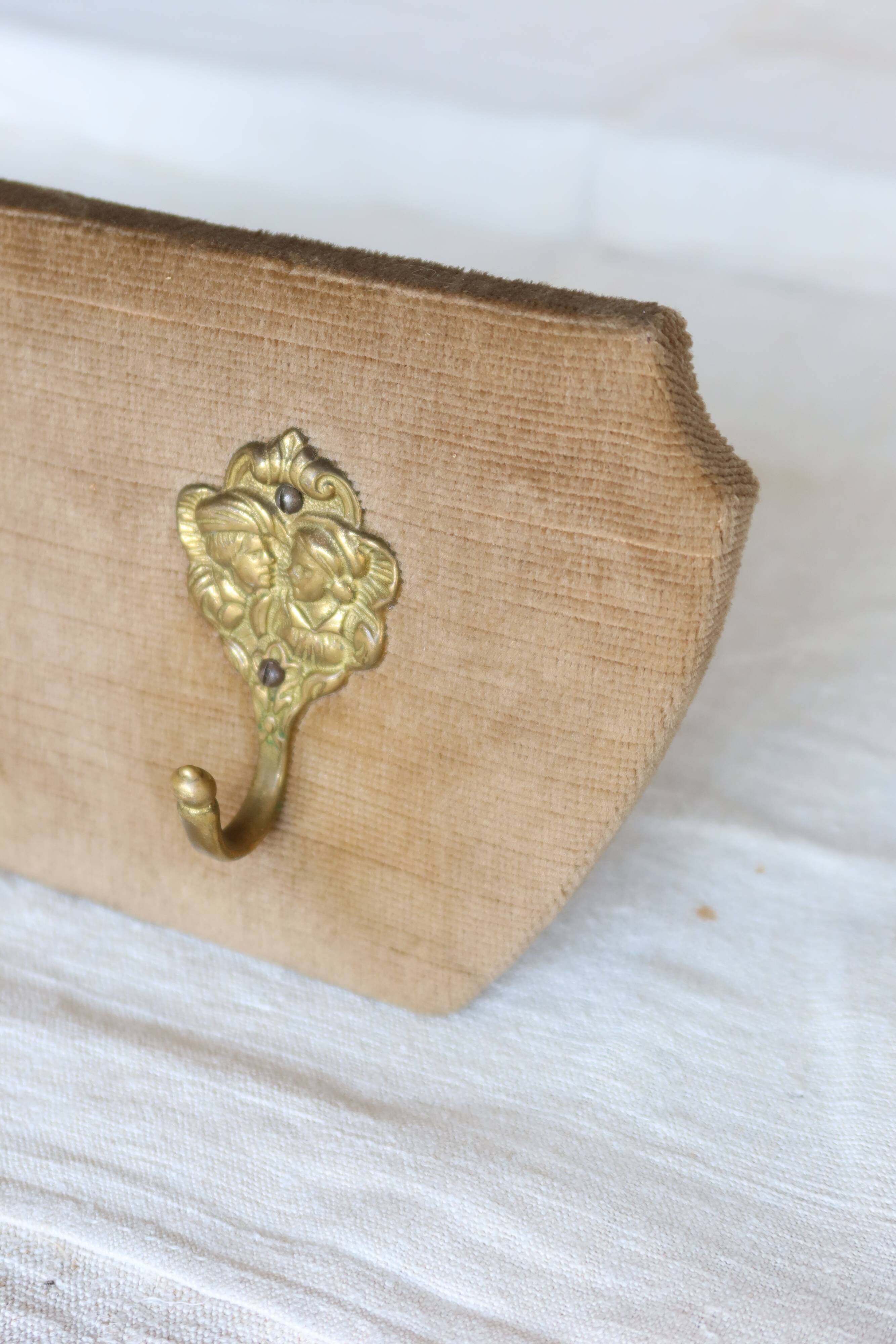 Vintage velvet coat rack with brass hooks