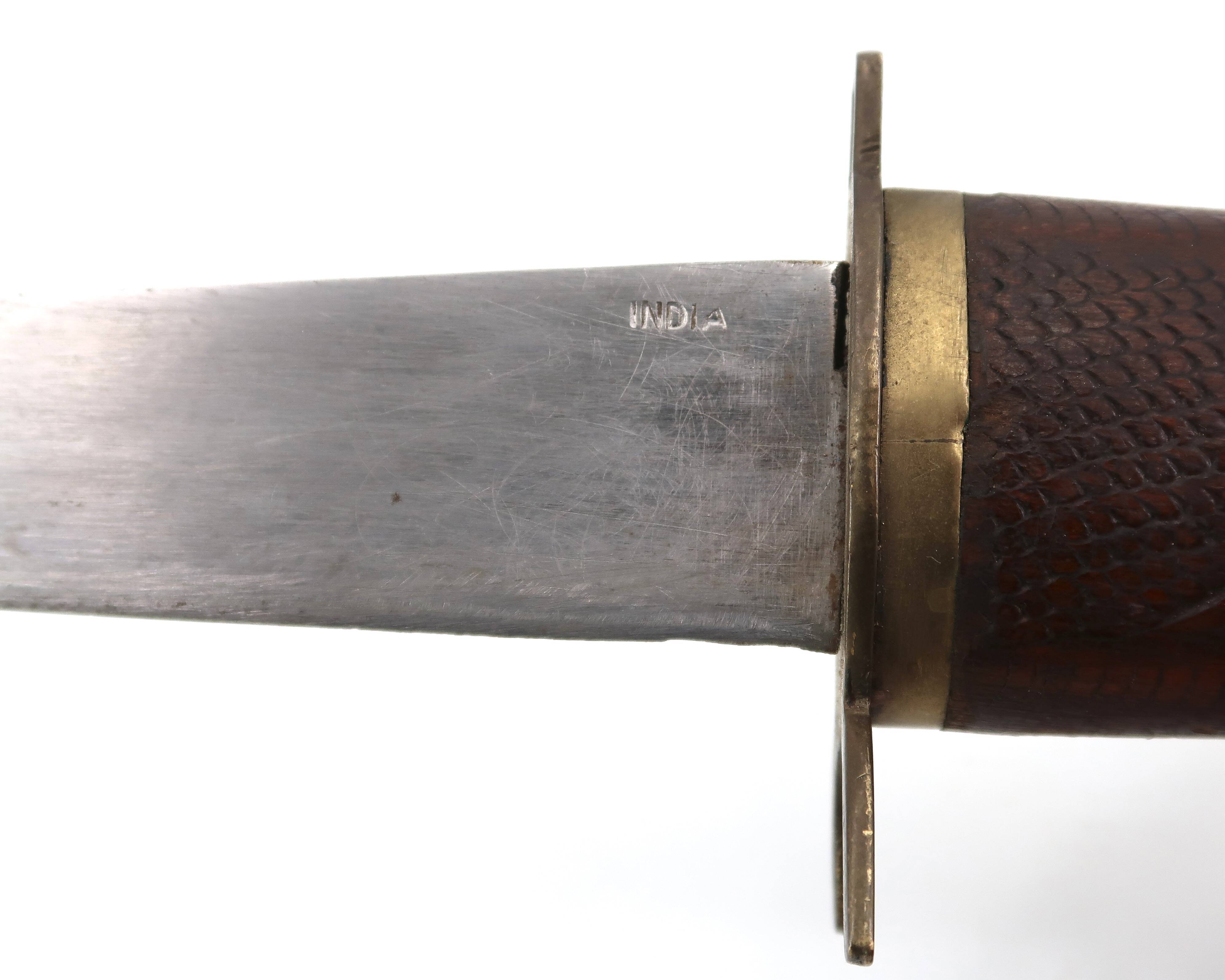 Fish knife and fork with a wooden and brass sheath sculpture.