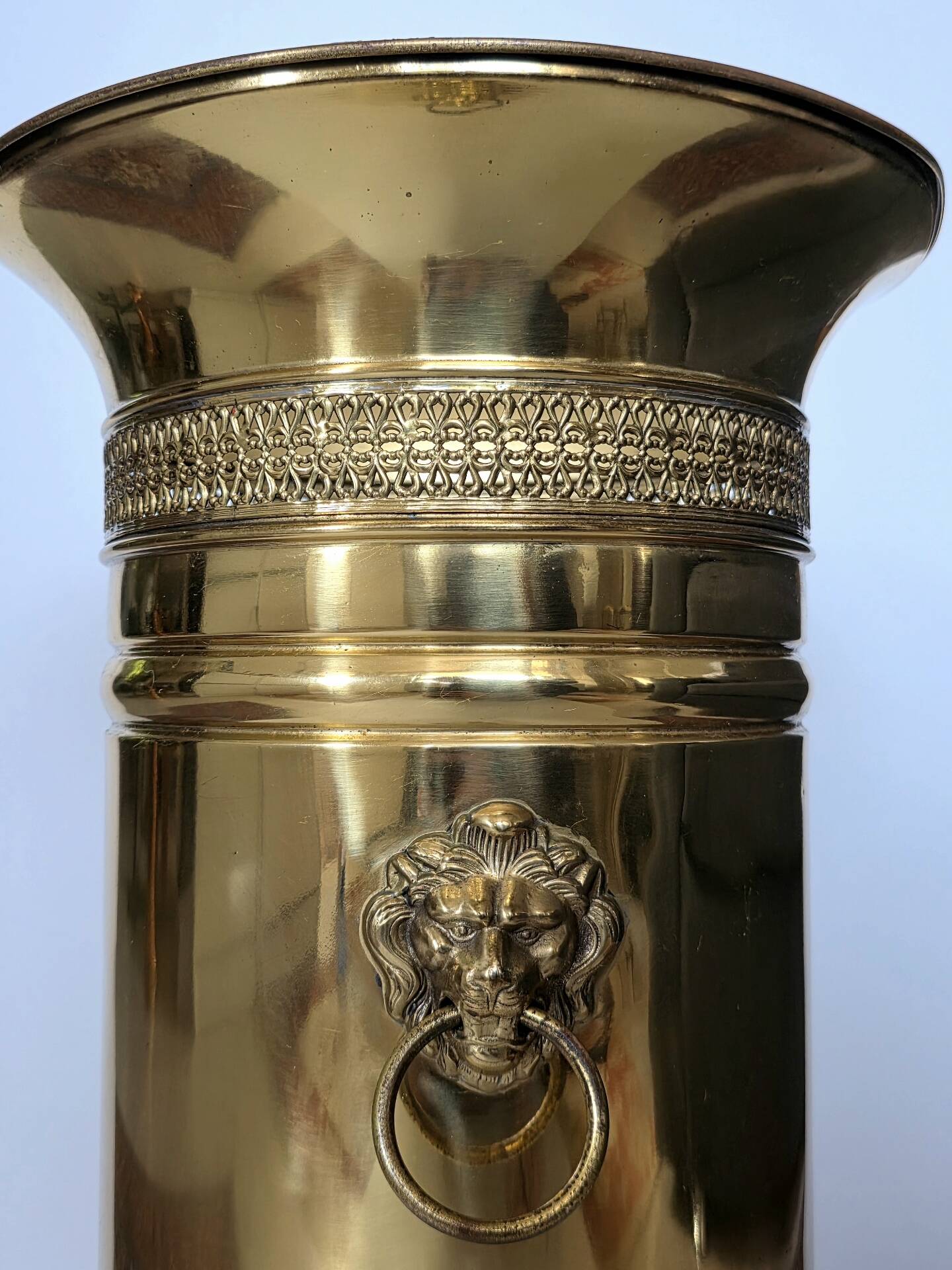 Hollywood Regency style umbrella stand, brass finish and lio pattern.