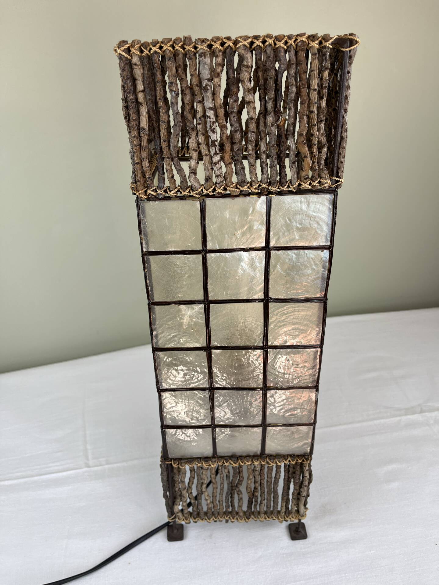 Capiz shell lamp and woven twigs