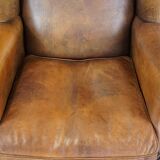 Large sheep leather wingback chair correctly finished with decorative nails
