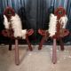 Pair of brutalist tripod chairs in wood and cowhide