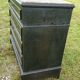 Blackened wooden chest of drawers with 5 drawers