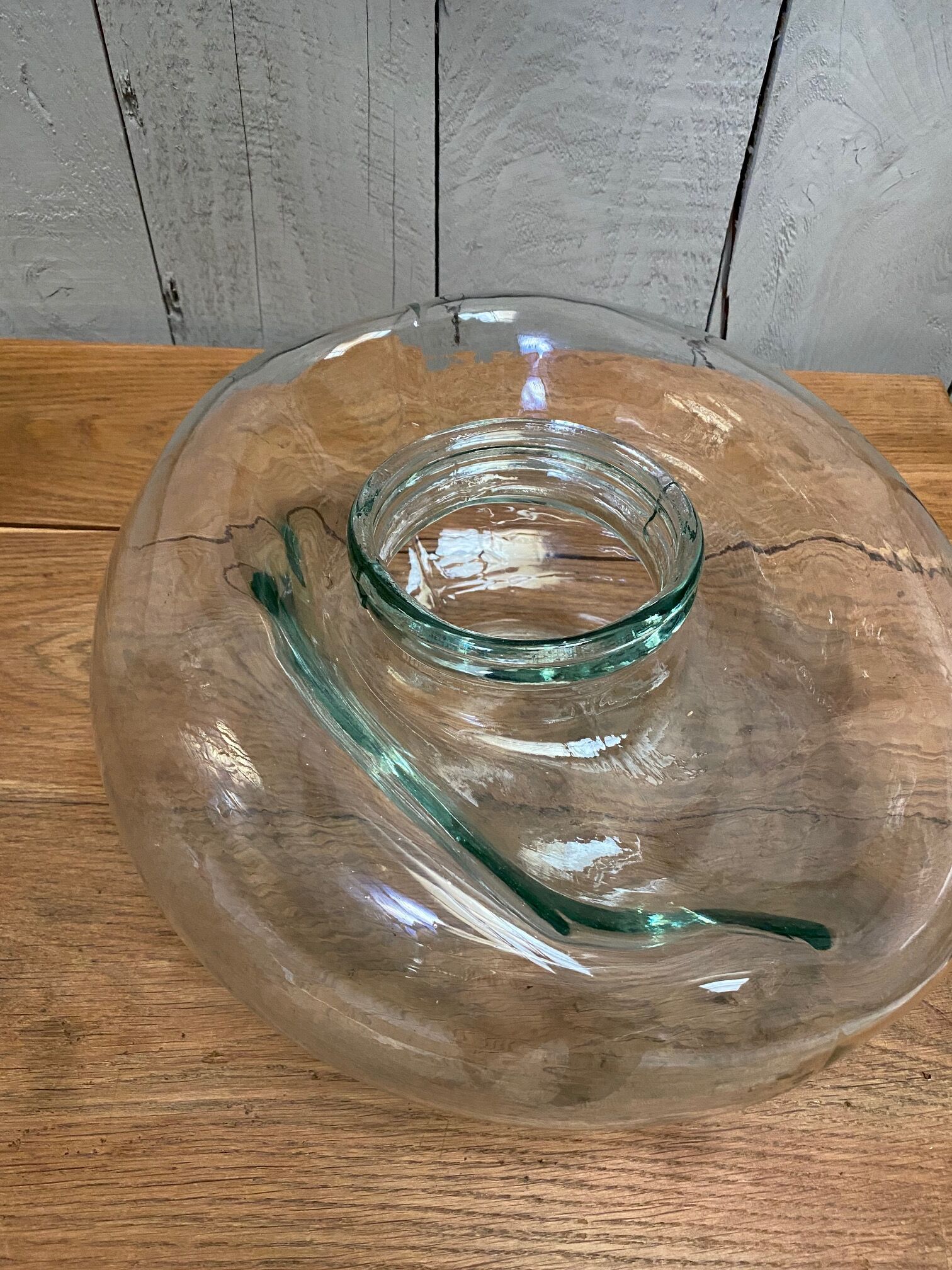 Old jar made of deformed glass