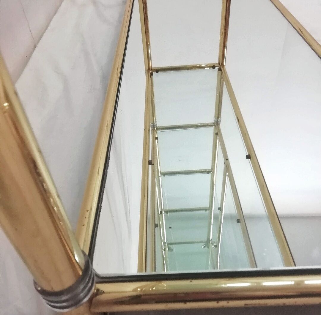 Hollywood Regency brass and glass shelf with elephant heads from the 1970s