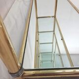 Hollywood Regency brass and glass shelf with elephant heads from the 1970s