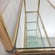 Hollywood Regency brass and glass shelf with elephant heads from the 1970s