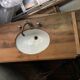 Washbasin recessed in old wood