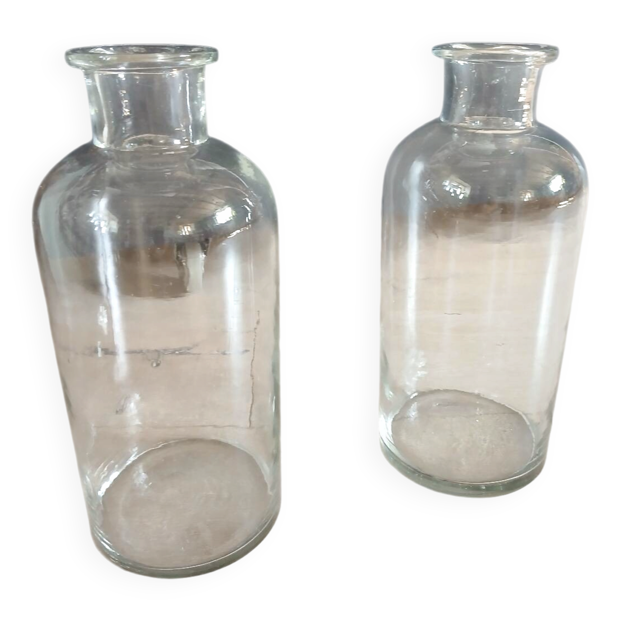 2 large antique transparent glass bottles