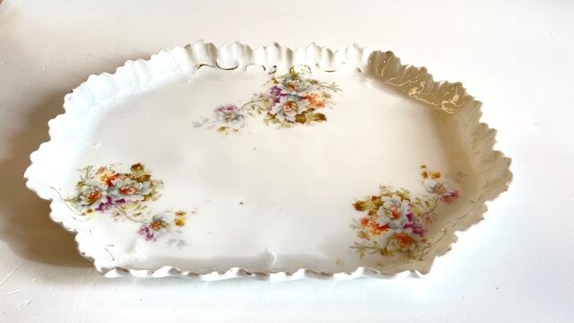 Old tray in floral pattern biscuit