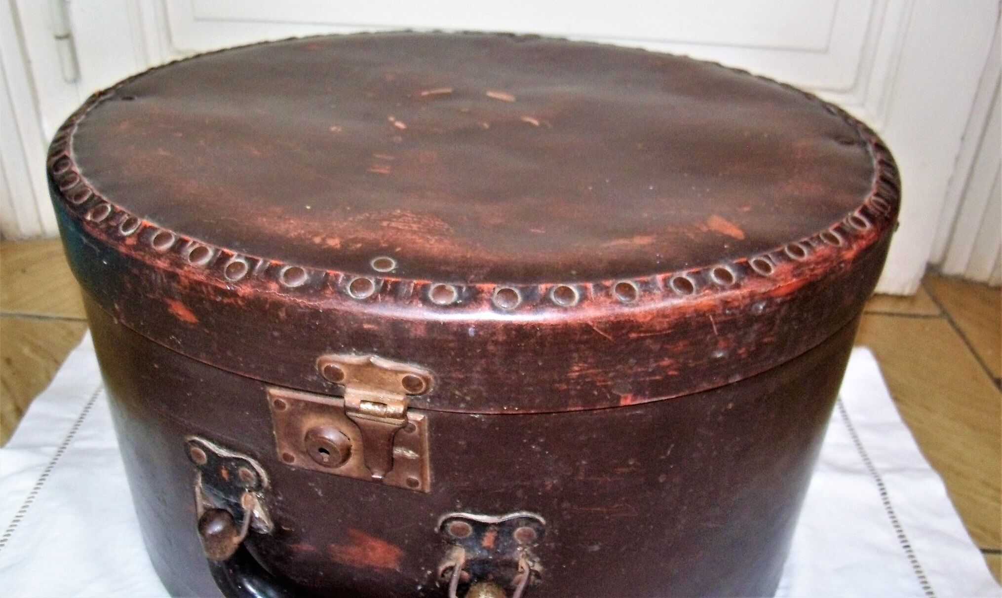 Studded old leather hat box
