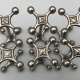 Set of 6 old table knife resistors in the shape of crossbars in silver metal
