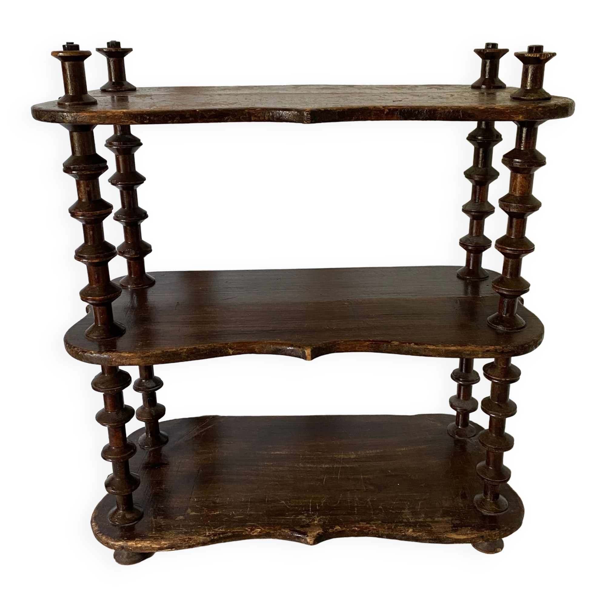 Old shelf in turned wood like reels