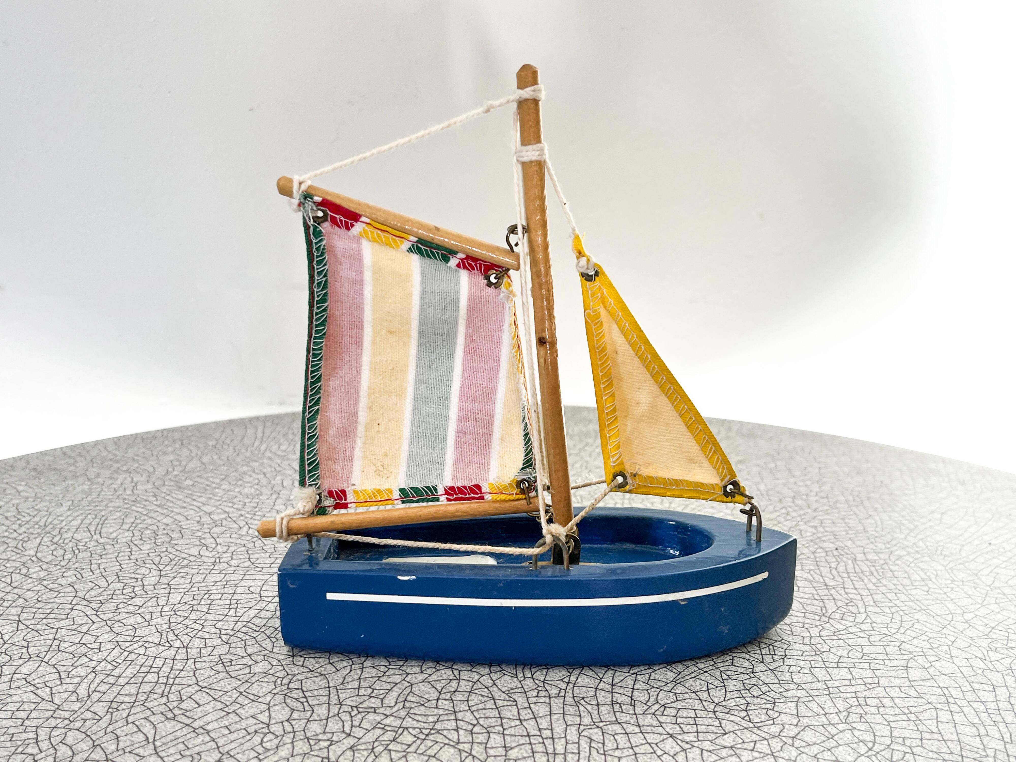 Wooden bathtub sailboat, perhaps a Tirot.