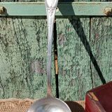 Silver-plated ladle in its screen