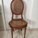 Antique chair Louis XVI style, seat caned, carved wood