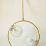 Mid century modernist pendant light in brass and textured glass ball