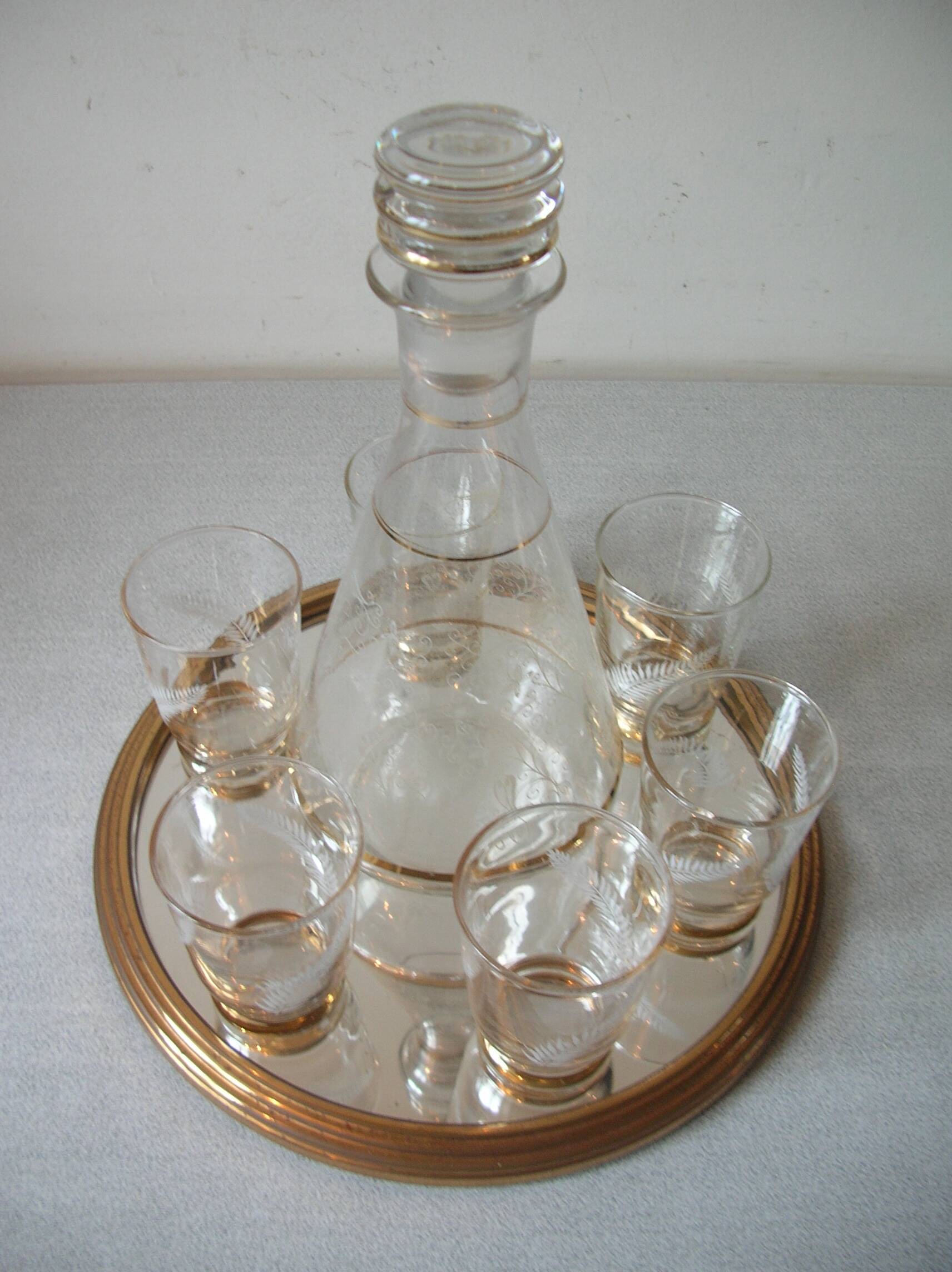 Old glass carafe liquor service with gilding vintage ice mirror tray