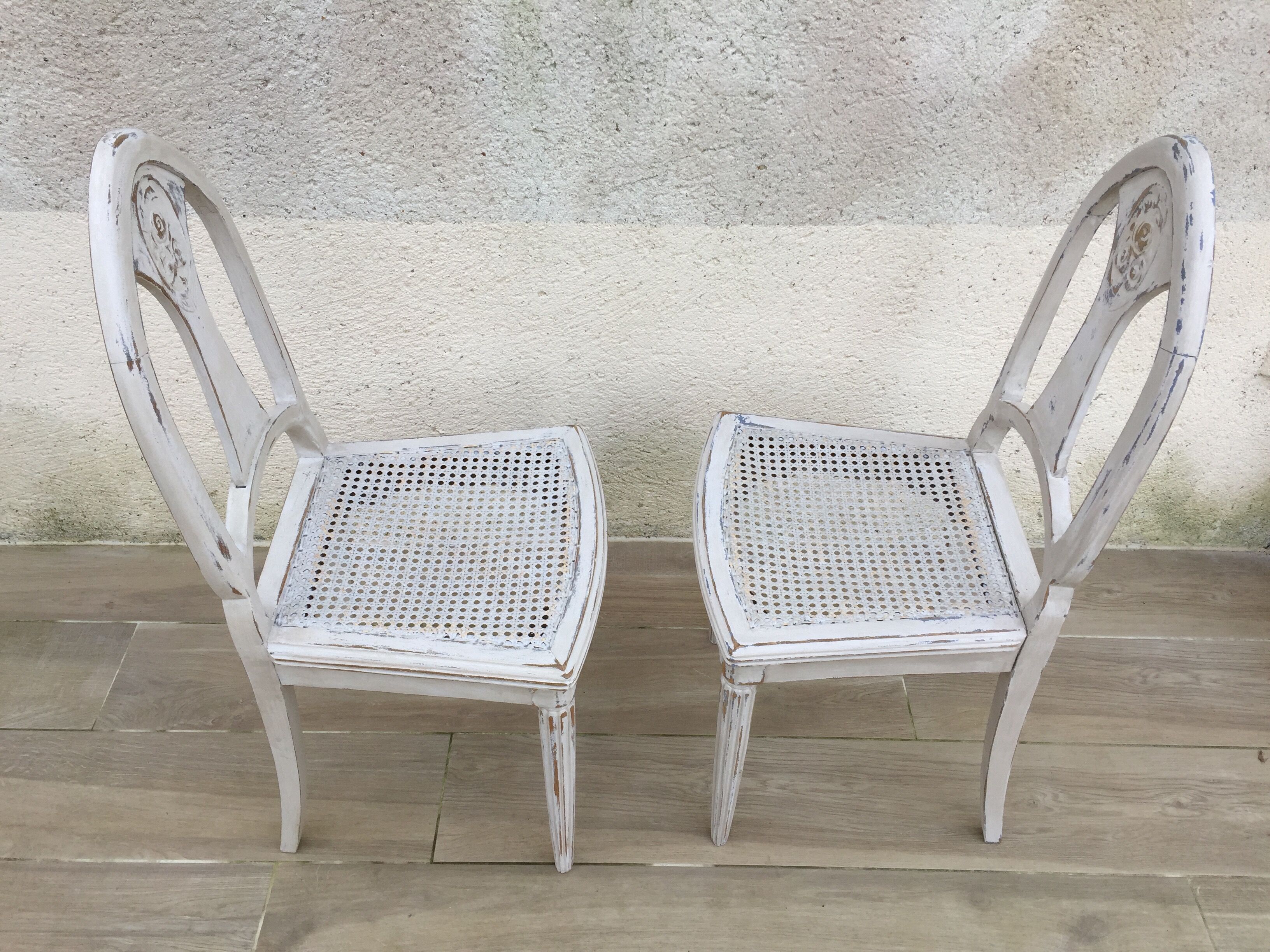 Pair of old white canne chairs