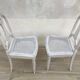 Pair of old white canne chairs