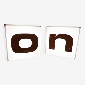 Pair of square illuminated sign letters from 1970