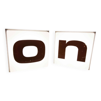 Pair of square illuminated sign letters from 1970