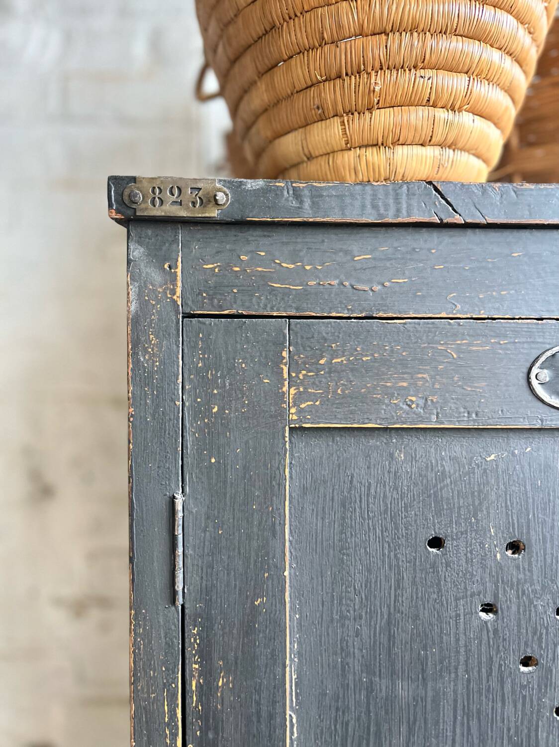 Old wooden locker with black patina