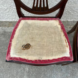 Set of 6 wooden chairs sitting red