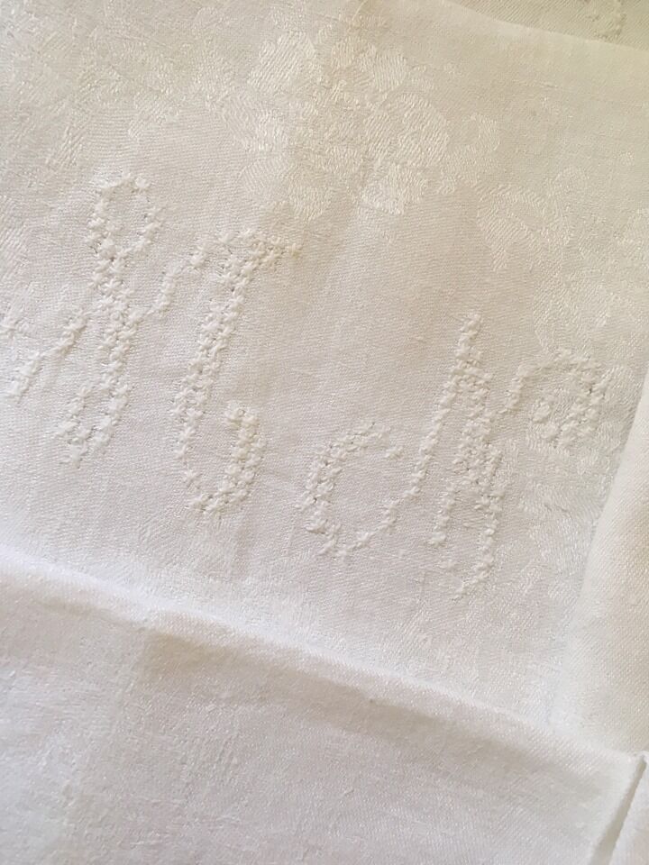 Six damask white towels and embroidered M N.