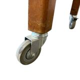 Vintage wooden high table on wheels