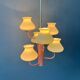 Mid-century opaline glass chandelier with a pink structure.