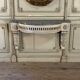 Louis XVI wall console in carved wood, grey patina, 18th century.