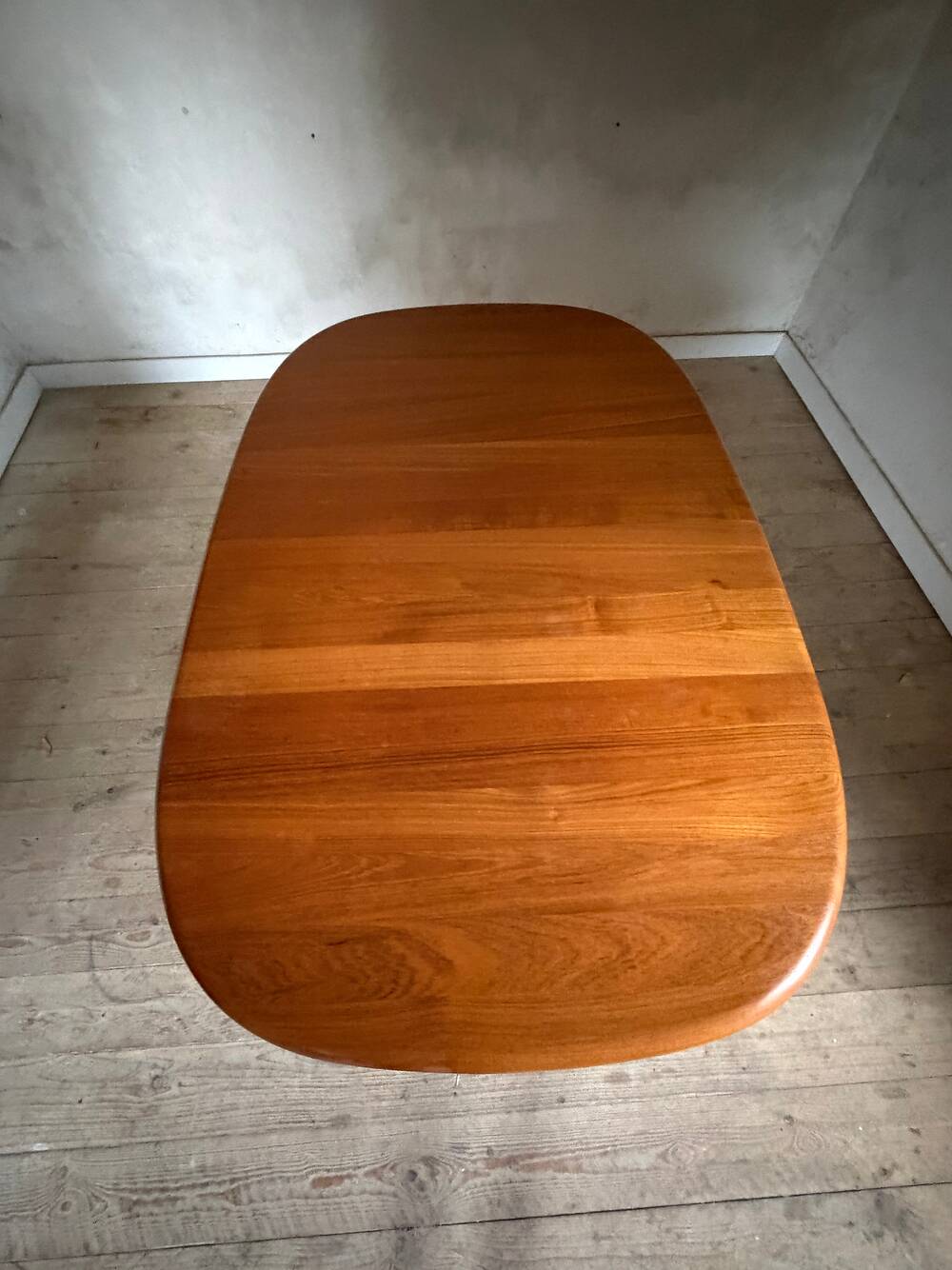 Vintage oval teak Scandinavian table with a central star base from Glostrup.