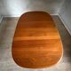 Vintage oval teak Scandinavian table with a central star base from Glostrup.