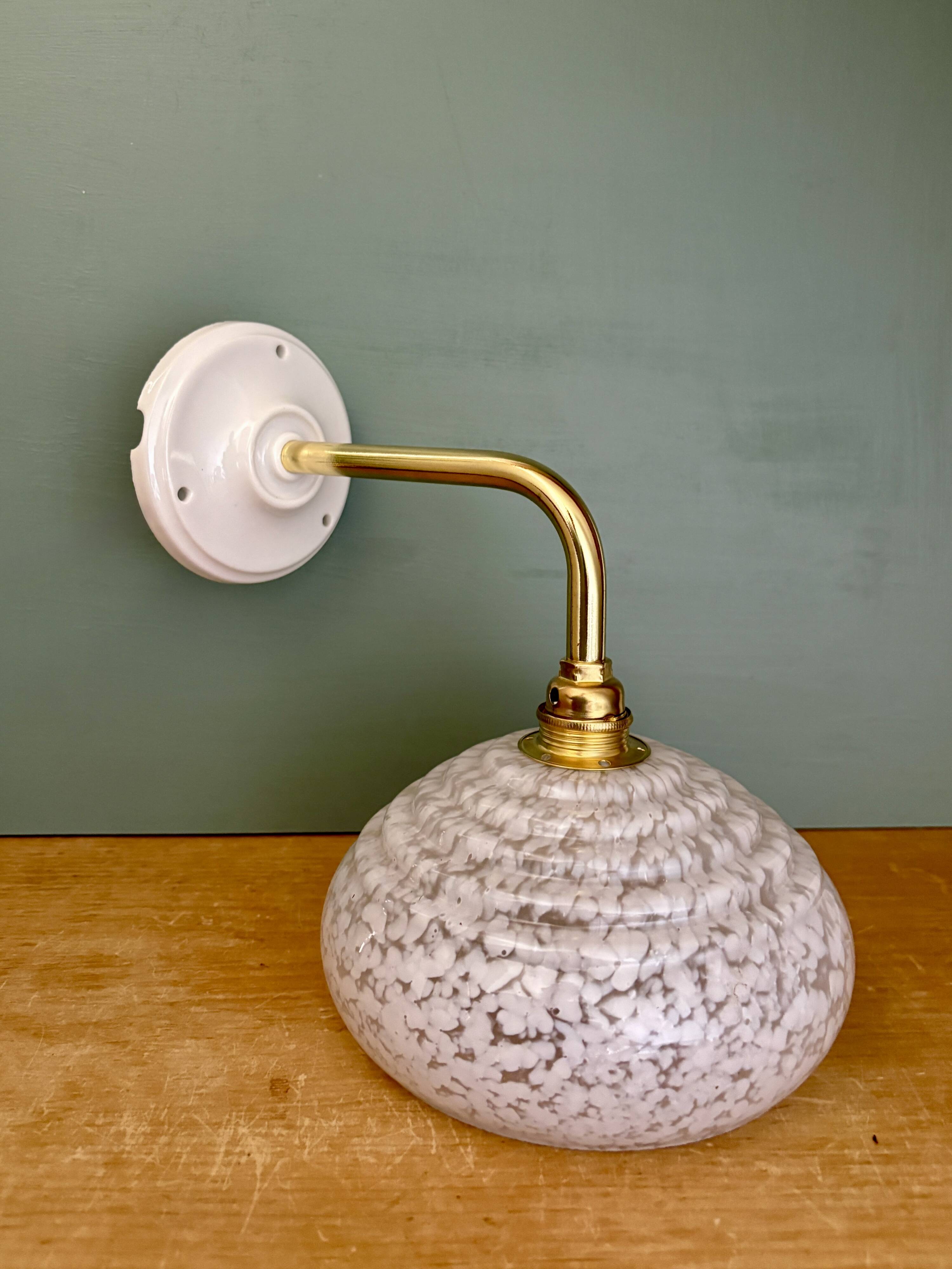 Vintage glass wall lamp with a white Clichy shade.