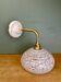 Vintage glass wall lamp with a white Clichy shade.