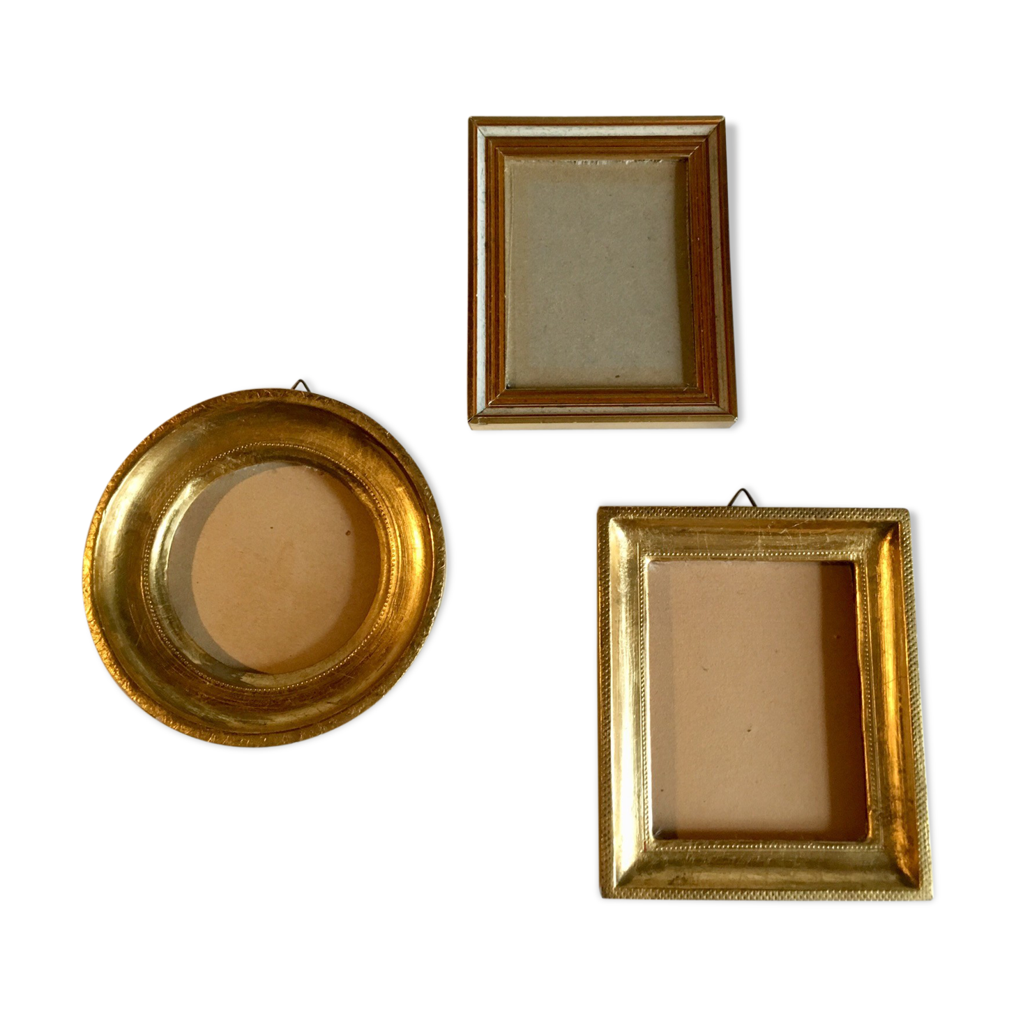 Trio of round golden wood frames and rectangles